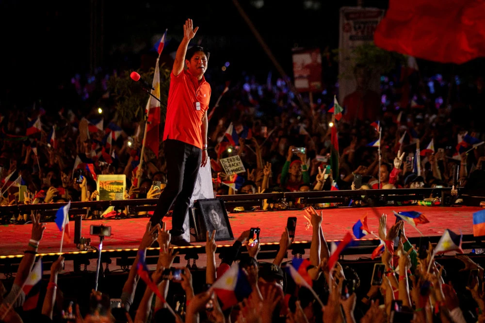 Ferdinand “Bongbong” Marcos Jr., the son and namesake of the late Philippine dictator, gestures to the crowd after delivering a speech in a campaign rally in San Fernando, Pampanga province, Philippines, April 29, 2022. (Reuters)