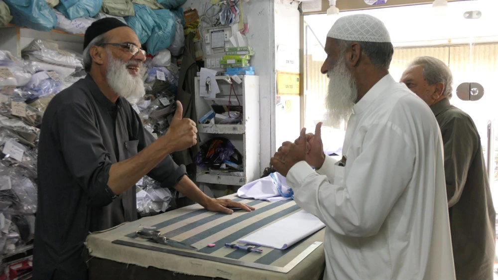 Haroon Razzaq communicates with customers at this shop in Yat Road, Quetta, Balochistan, southwestern Pakistan, on April 24, 2022. (AN Photo)