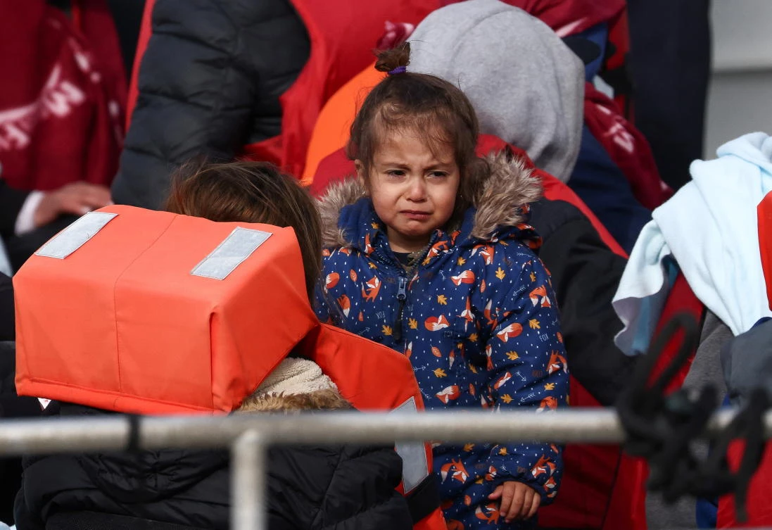 Migrants arrive onboard a Border Force vessel into Dover Harbor after being rescued while crossing the English Channel in Dover, Britain, May 3, 2022. (Reuters)