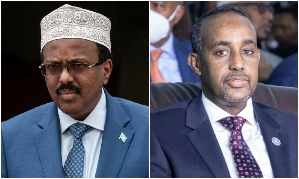 Election is over a year behind schedule, marred by power struggle between President Mohamed Abdullahi Mohamed and PM Mohamed Hussein Roble (R). (File/AFP)