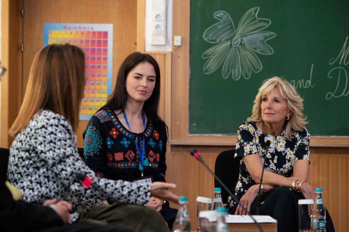 US First Lady Jill Biden (R) listens to Ukrainian teacher Anastasia Konovalova (L), next to Ukrainian refugee mother Svitlana Gollyak during a meeting with Ukrainian teachers and refugees at the "Uruguay Gymnasium School", in Bucharest. (AFP)