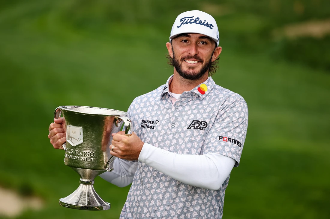 Max Homa with the champion trophy after winning the Wells Fargo Championship golf tournament on Sunday. (USA TODAY Sports)