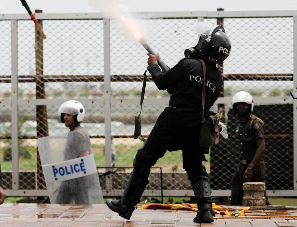 Riot police fire tear gas at supporters of Sri Lanka’s ruling party during a clash with anti-government demonstrators, amid the country’s economic crisis, Colombo, Sri Lanka, May 9, 2022. (Reuters)