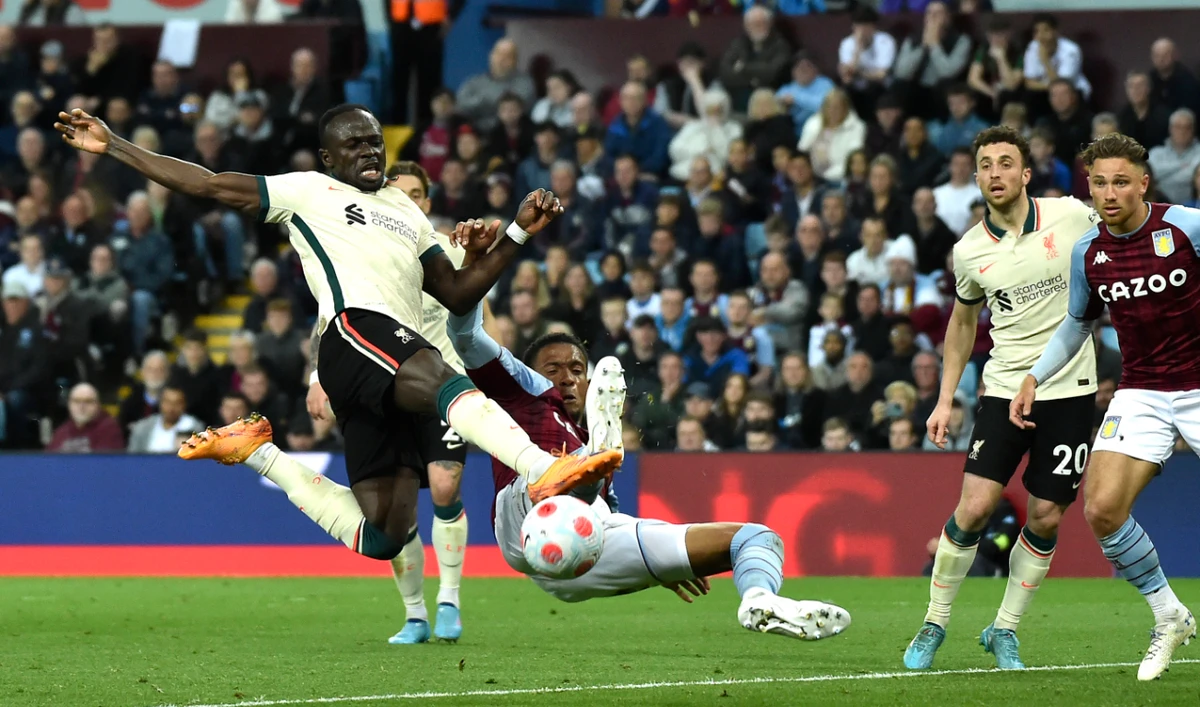 Liverpool's Sadio Mane scores against Aston Villa during their English Premier League at Villa Park in Birmingham, England, Tuesday, May 10, 2022. (AP)