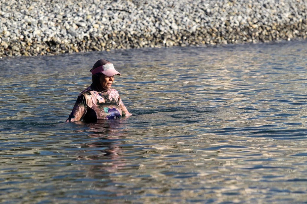 A French woman wears a burkini as she swims on a beach in Nice, southeastern France. (File/AFP)