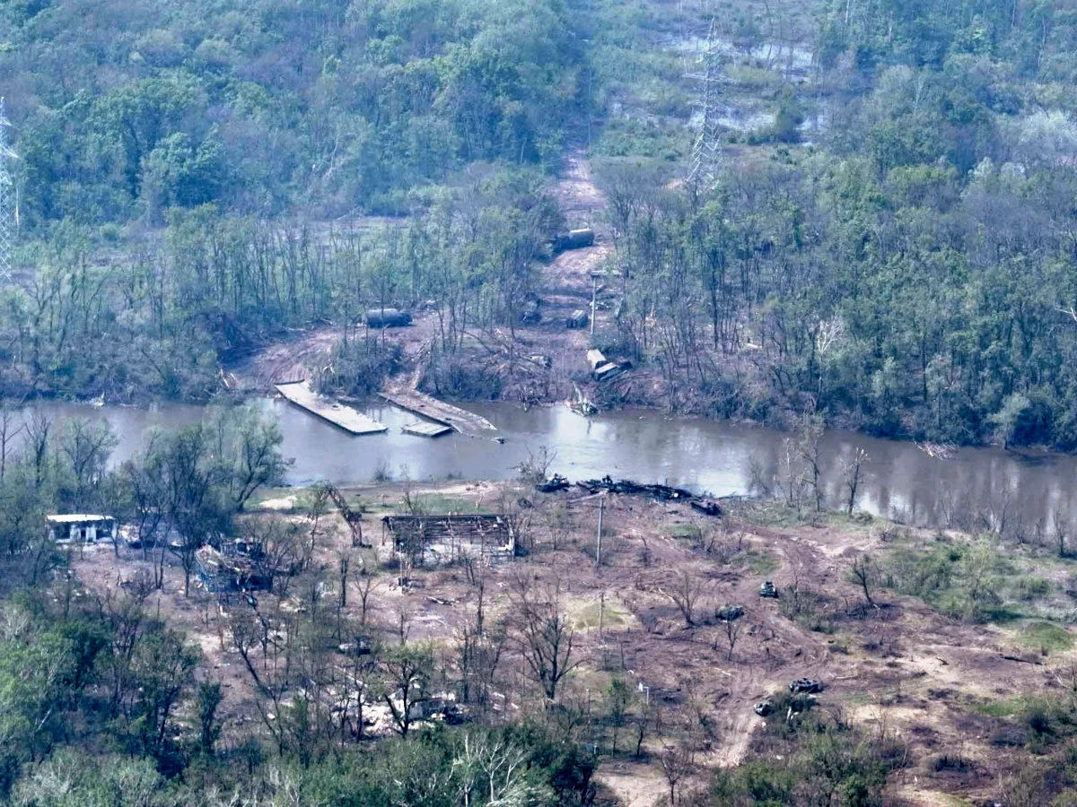 Russian armored vehicles are strewn on the banks of Siverskyi Donets River after their pontoon bridges were blown up by Ukrainian forces. (Ukraine Armed Forces via AP)