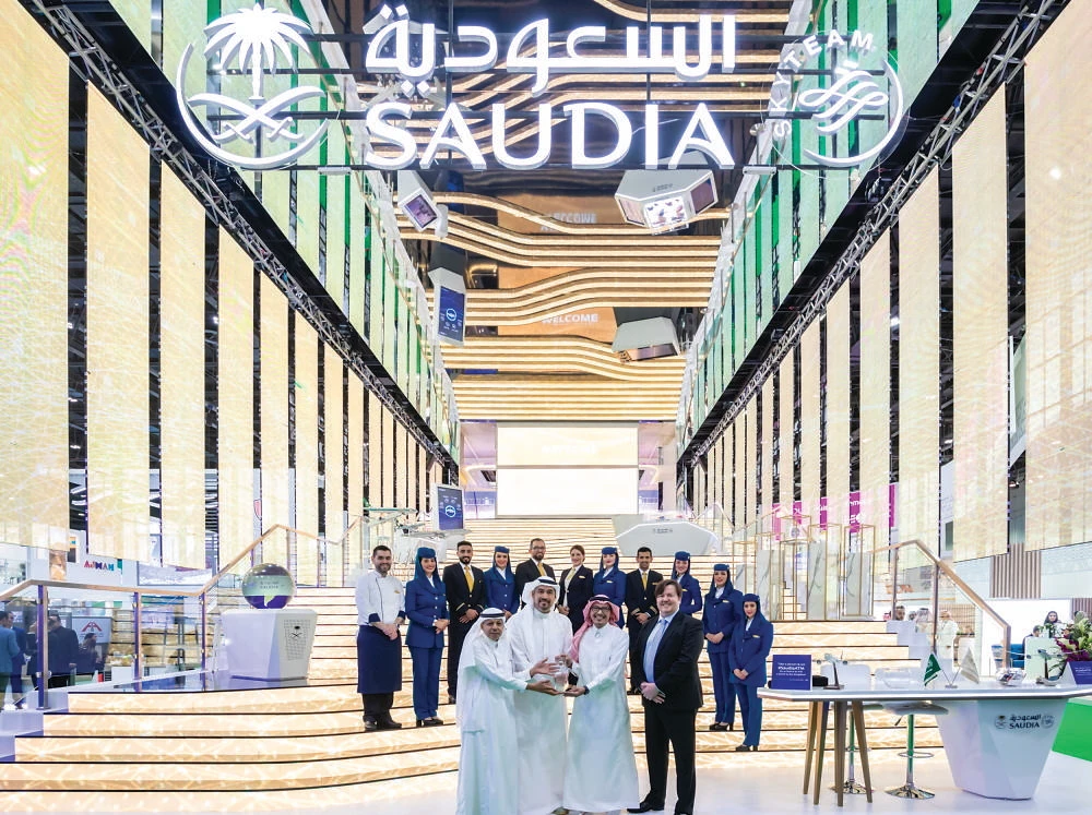 Saudi Arabian Airlines’ team members receive an award at ATM 2022.