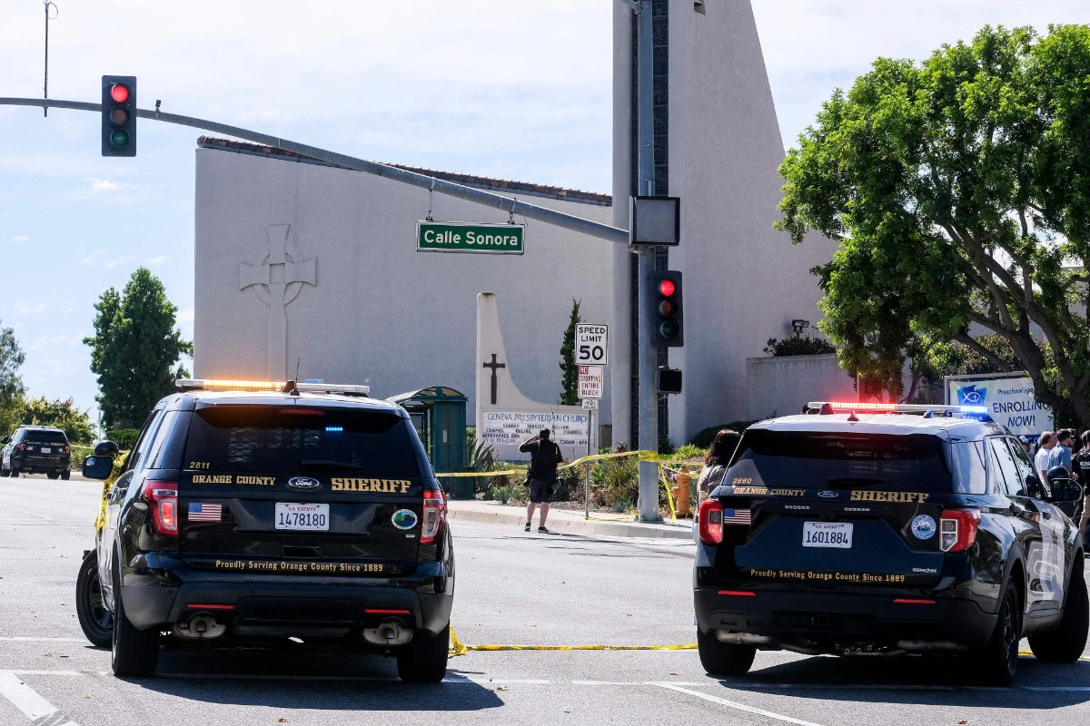 Police vehicles are seen after a shooting inside Geneva Presbyterian Church in Laguna Woods, California, on May 15, 2022. (AFP)