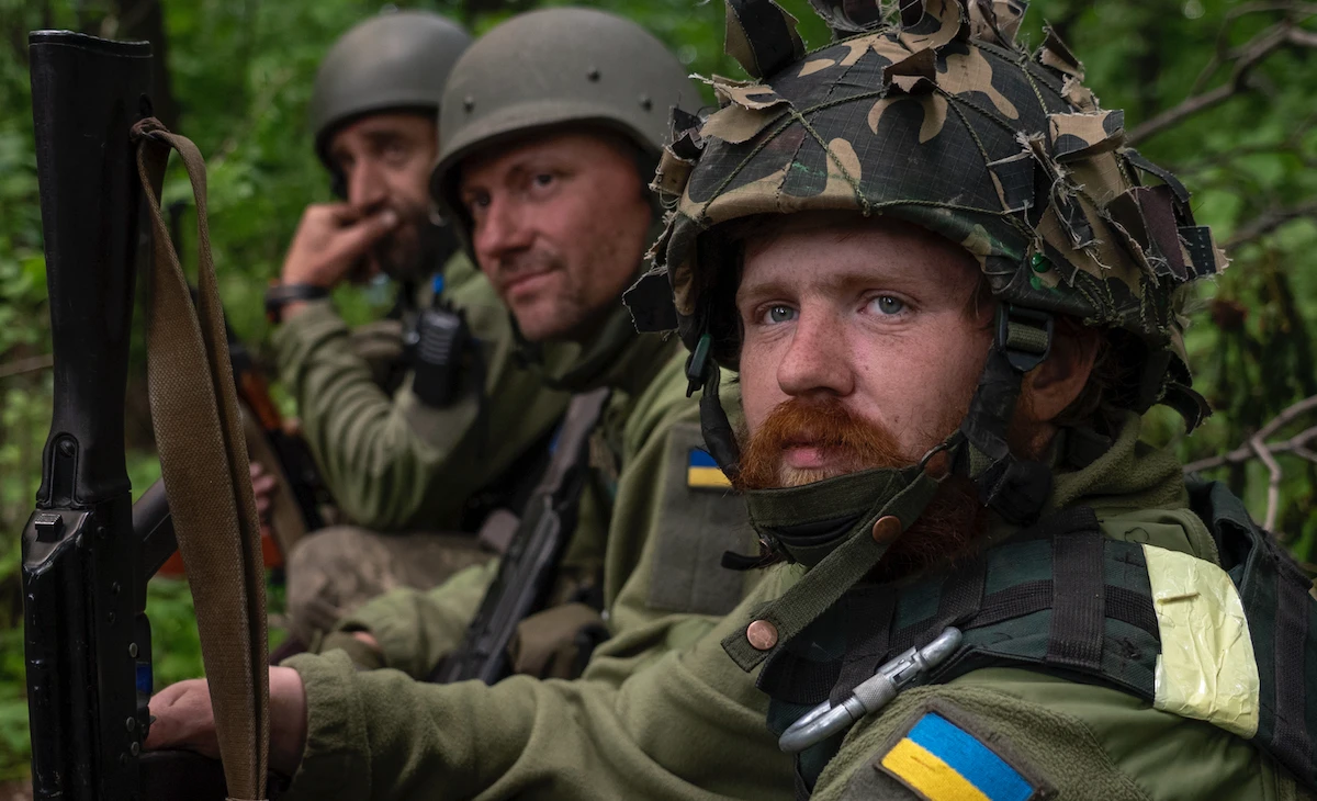 Ukrainian servicemen take rest in a recently retaken village north of Kharkiv, east Ukraine, Sunday, May 15, 2022. (AP)