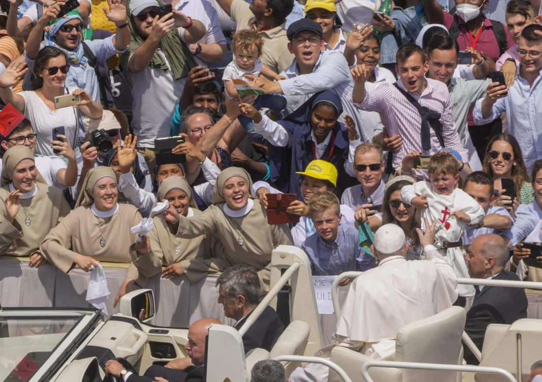Pope Francis cheers at a child as he leaves at the end of the canonization mass for ten new saints in St. Peter’s Square at The Vatican on Sunday. (AP)