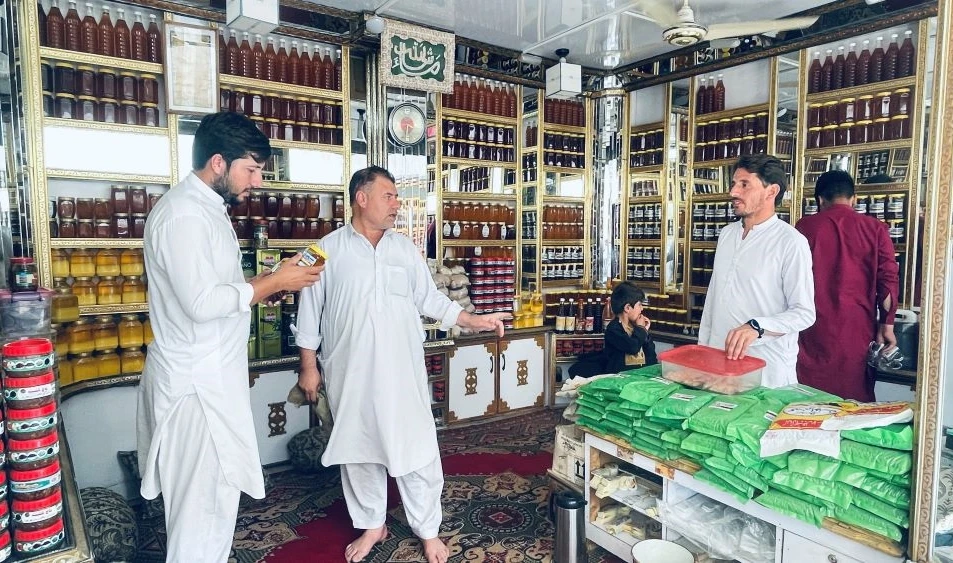 Various kinds of honey are on display at a shop in the Koga refugee camp, Buner district, Khyber Pakhtunkhwa, Pakistan, May 13, 2022. (AN Photo)