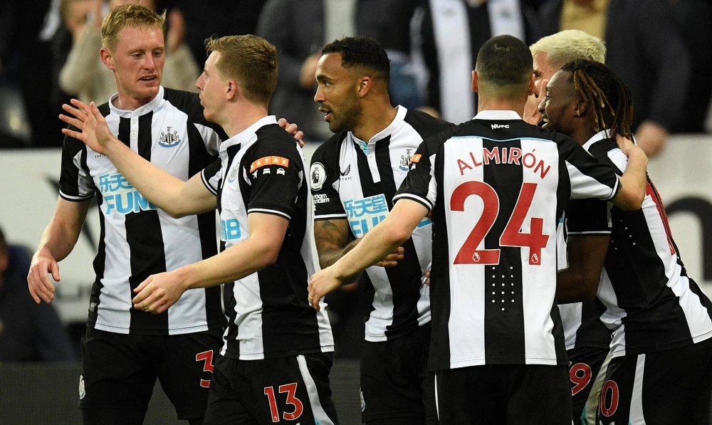 Newcastle players celebrate the goal during their English Premier League football match against Arsenal at St James' Park in Newcastle-upon-Tyne, north east England on May 16, 2022. (AFP)