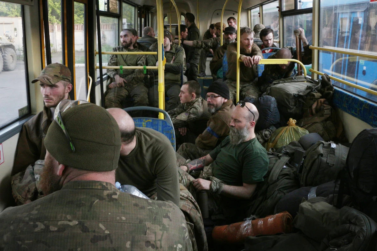 Ukrainian soldiers are evacuated on a bus from the besieged Mariupol's Azovstal steel plant to two towns controlled by Russian-allied separatists on May 17, 2022. (AP Photo)