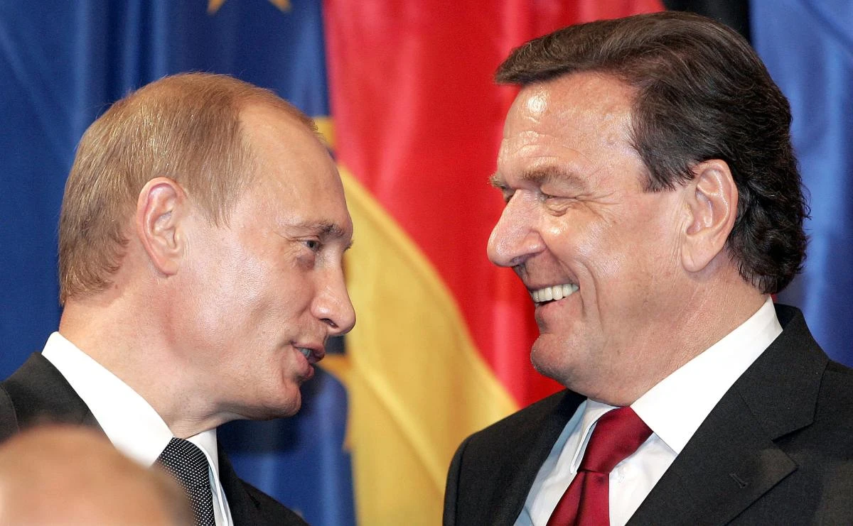 In this file photo taken in 2005 then German chancellor Gerhard Schroeder listens to then Russian President Vladimir Putin in Berlin. (AFP)