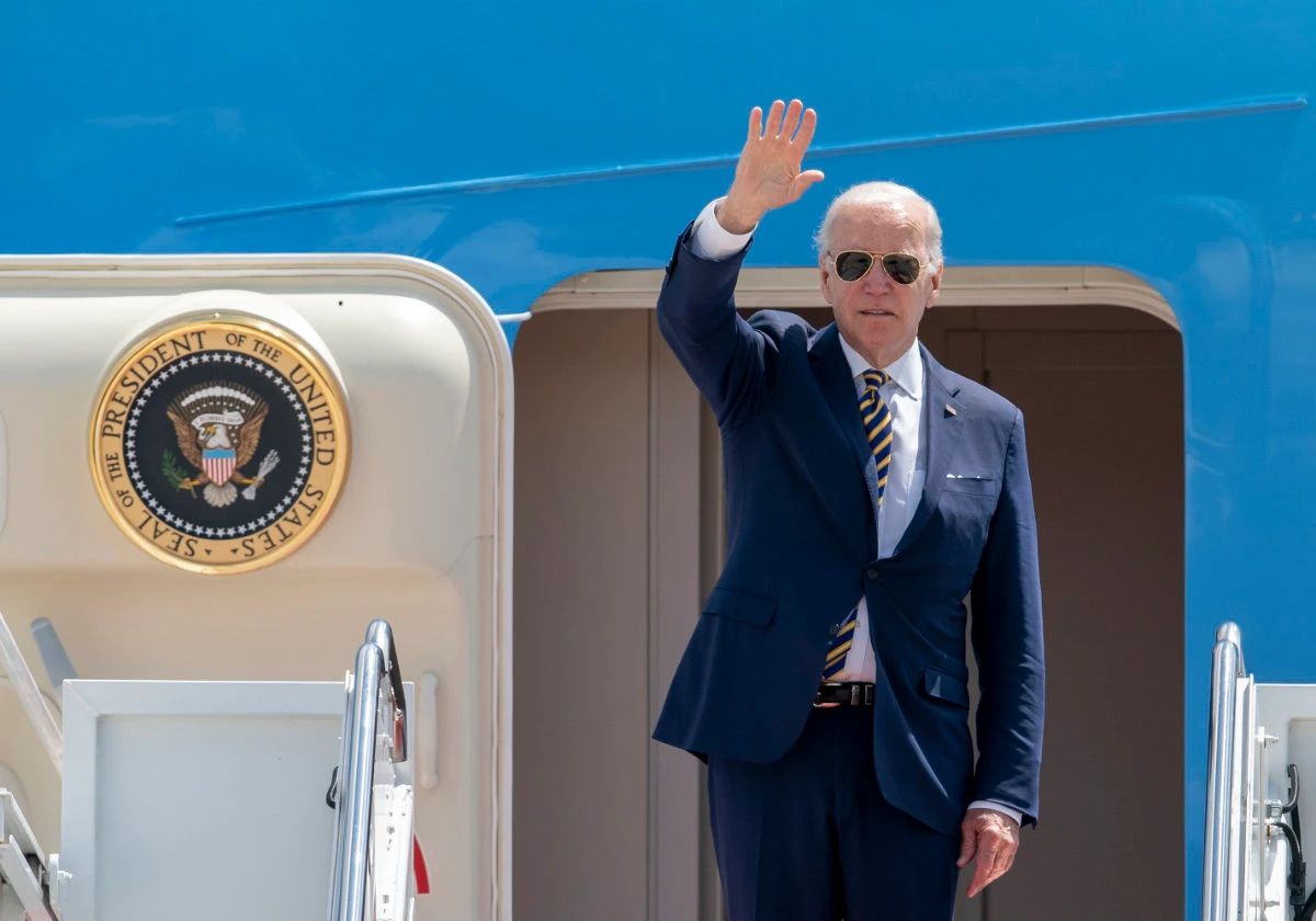 President Joe Biden bids goodbye as he boards Air Force One at Andrews Air Force Base in Maryland on May 19, 2022, ton his way to Seoul, Korea. (AP Photo)