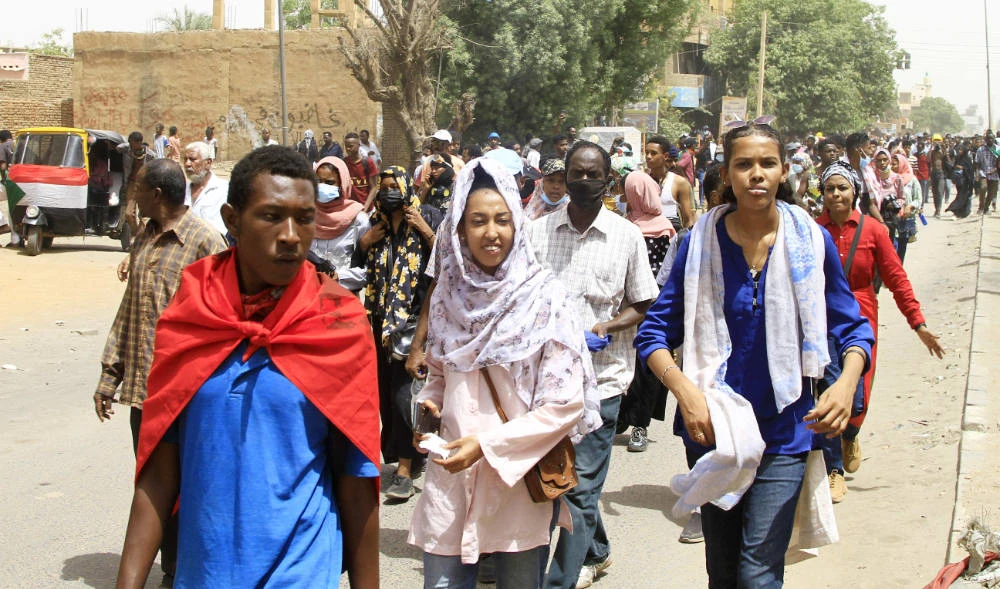 Sudanese demonstrators take to the streets of the capital Khartoum on May 19, 2022, calling for civilian rule and denouncing the military administration. (AFP)