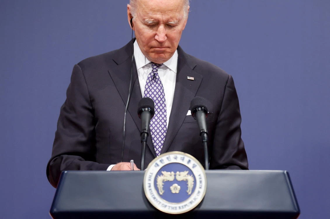 President Joe Biden signed the measure under unusual circumstances: a US official brought a copy of the bill on a commercial flight so the president could sign it. (Reuters)