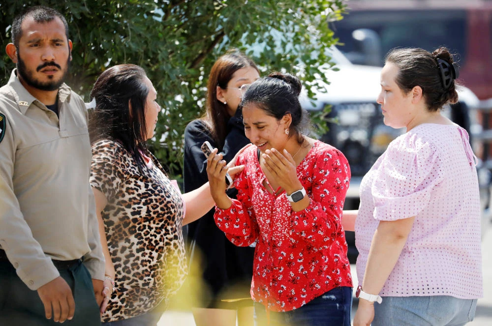 A woman reacts outside the Ssgt Willie de Leon Civic Center, where students had been transported from Robb Elementary School after a shooting, in Uvalde, Texas, U.S. May 24, 2022. (REUTERS)