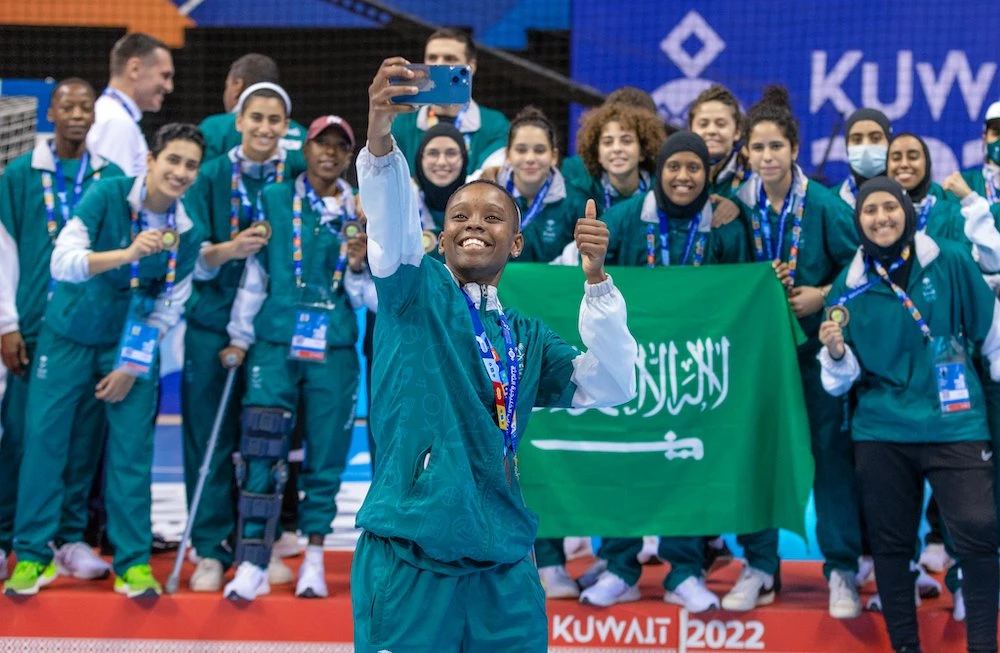The Saudi women’s futsal team celebrate winning bronze at the 3rd GCC Games in Kuwait. (SOPC)