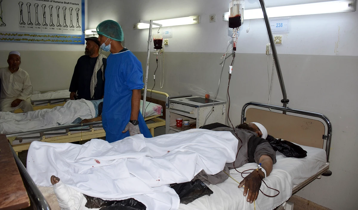 Wounded men receive treatment in a hospital, after a bombing in Mazar-e-Sharif, northern Afghanistan on May 25, 2022. (AP)