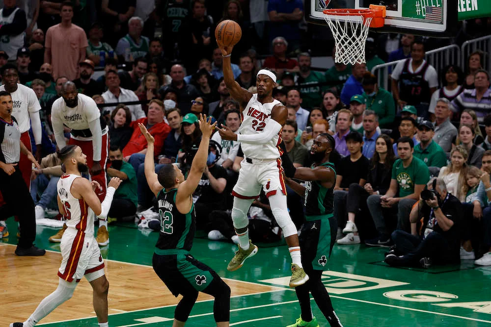 Miami Heat forward Jimmy Butler passes the ball against Boston Celtics forward Grant Williams (12) during the first half in Game 6 of the 2022 Eastern Conference finals at TD Garden. (USA TODAY Sports)