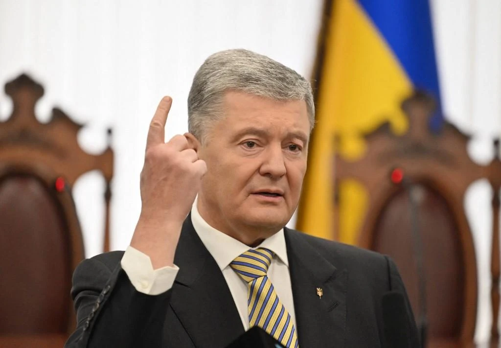 Petro Poroshenko, in power from 2014 to 2019, was due to travel to a NATO parliamentary assembly meeting in Lithuania as part of the Ukrainian delegation, and had received official permission to travel. (AFP)