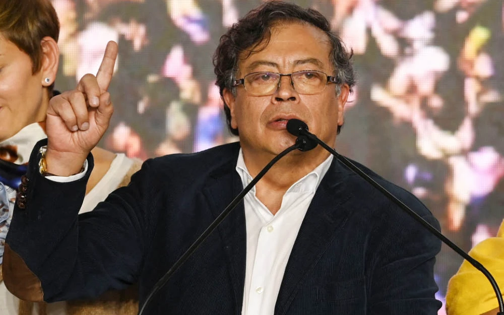 Colombian presidential candidate for the Historic Pact coalition, Gustavo Petro speaks while celebrating at the party headquarters, in Bogota on May 29, 2022, on election day. (AFP)