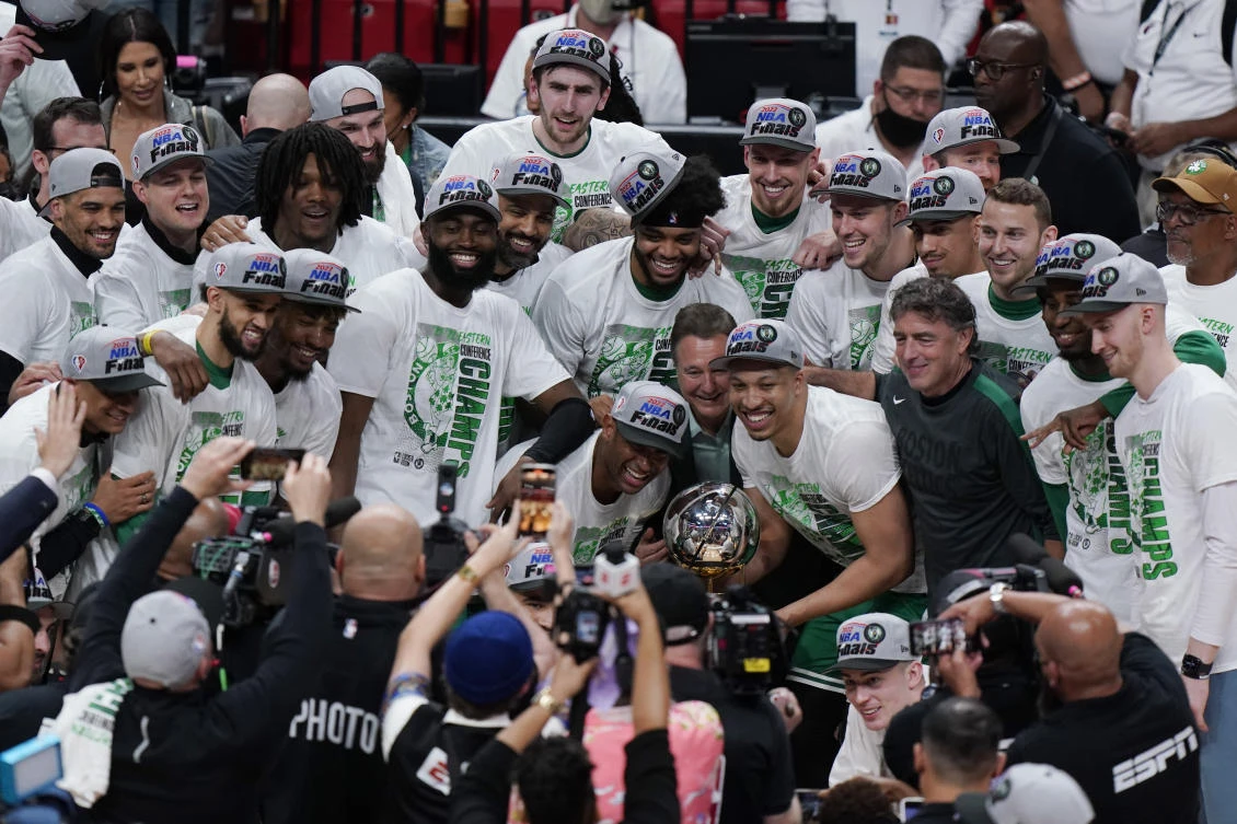 The Boston Celtics pose with the NBA Eastern Conference trophy after defeating the Miami Heat in the Eastern Conference finals playoff series. (AP)