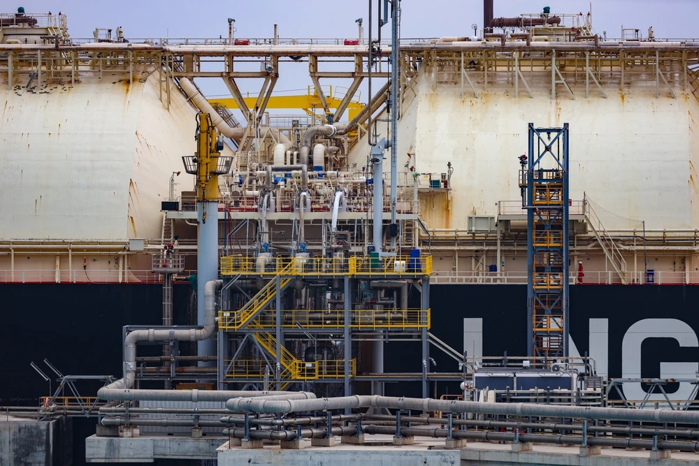 Liquefied Natural Gas Floating Storage Unit. LNG tanker moored to a jetty. (Shutterstock)