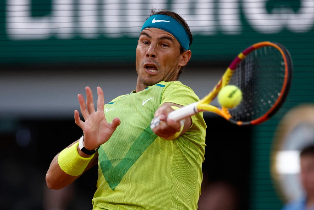 Nadal wins epic four-set clash with Djokovic to make French Open semis