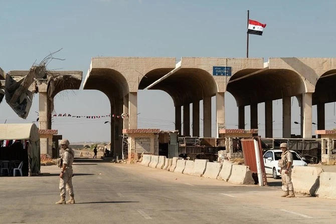 Soldiers guard Syria's Nassib border crossing with Jordan in this photo taken on August 14, 2018. (AFP)