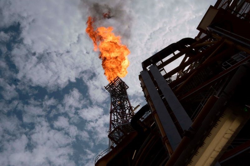A Total offshore facility sends flames into the sky off the coast of Angola. (AFP)