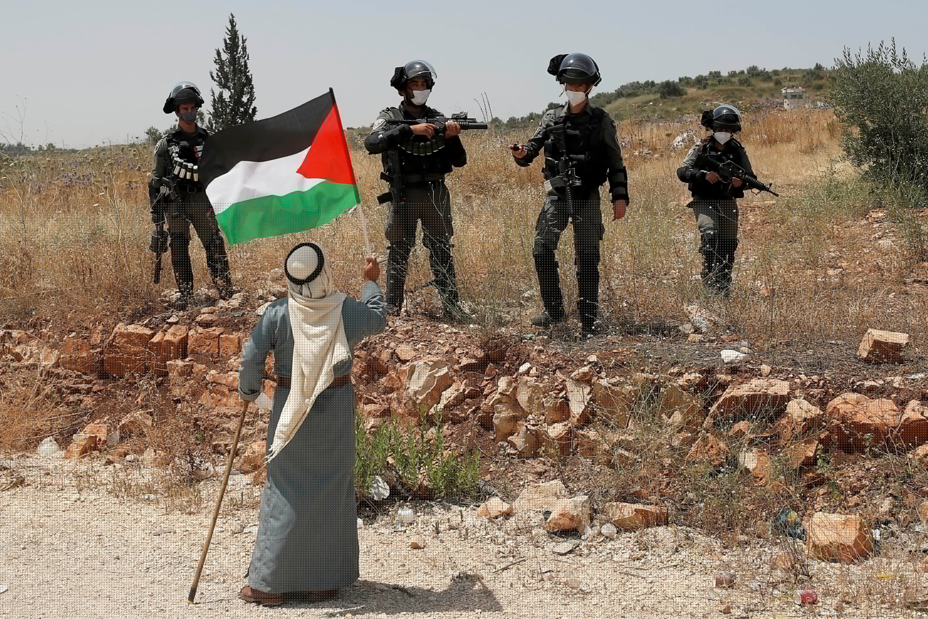 A Palestinian protests Israel’s plan to annex parts of the occupied West Bank, near Tulkarm, June 5, 2020. (Reuters)
