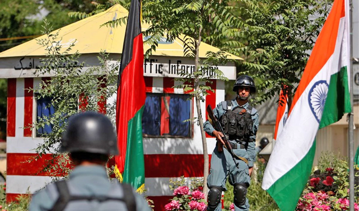 Afghan policemen stand guard next to Indian and Afghan national flags, at a check point in Kabul, Afghanistan, on May 12, 2011. (REUTERS/File)