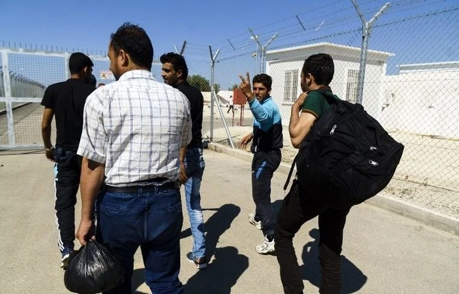 Syrian migrants arriving at Cyprus in 2018. Cypriot police said a man’s body was retrieved off the western coast on Thursday after newly arrived migrants said one among them had fallen overboard. (AFP)