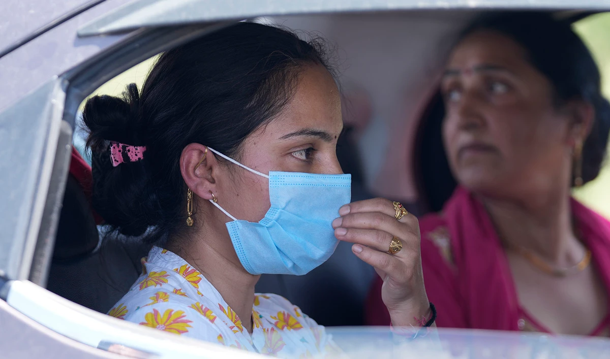 Kashmiri Hindus arrive after leaving the Muslim-majority Kashmir valley, in Jammu, India, on June 3, 2022. (AP)