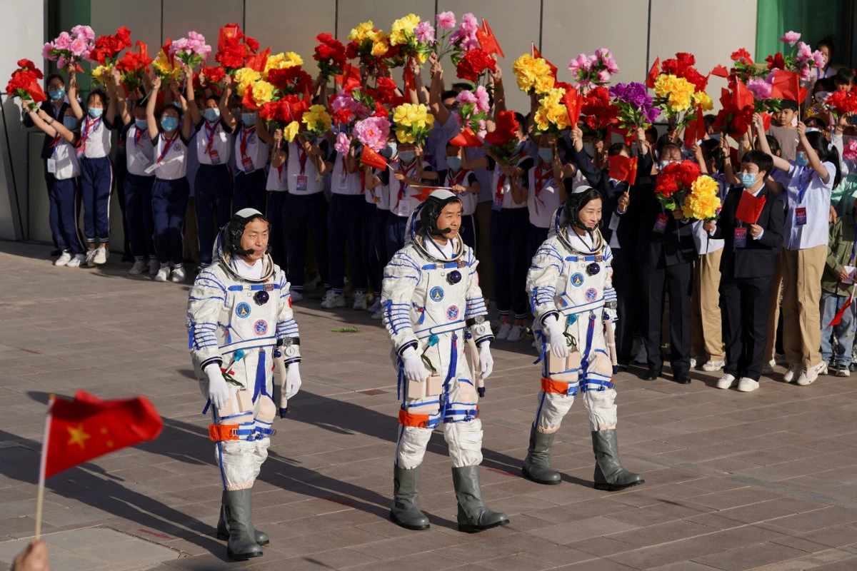 Chinese astronauts attend a see-off ceremony before the launch of the Long March-2F carrier rocket, carrying the Shenzhou-14 spacecraft for a crewed mission to build China's space station. (China Daily via REUTERS)