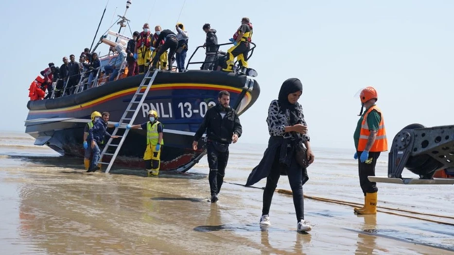Migrants disembark from a lifeboat at Dungeness in Kent, after being picked-up following an attempted small boat crossing of the English Channel, July 20, 2021. (Getty Images)