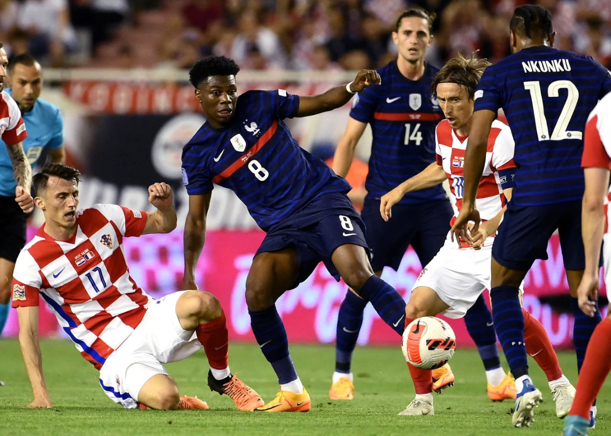 France's midfielder Aurelien Tchouameni (C) fights for the ball with Croatia's forward Ante Budimir (L) and midfielder Luka Modric (R) during their football match in Split on June 6, 2022. (AFP)
