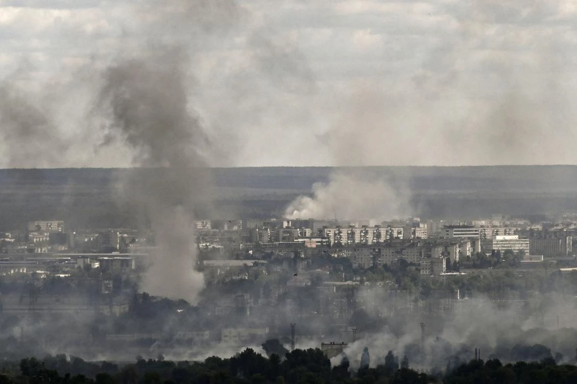 Smoke and dirt rise from shelling in the city of Severodonetsk during fight between Ukrainian and Russian troops on June 7, 2022. (AFP)