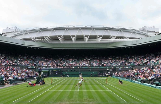 A general view of play on Center Court, with the roof open at The All England Tennis Club in Wimbledon in June 2021 (AFP/File)