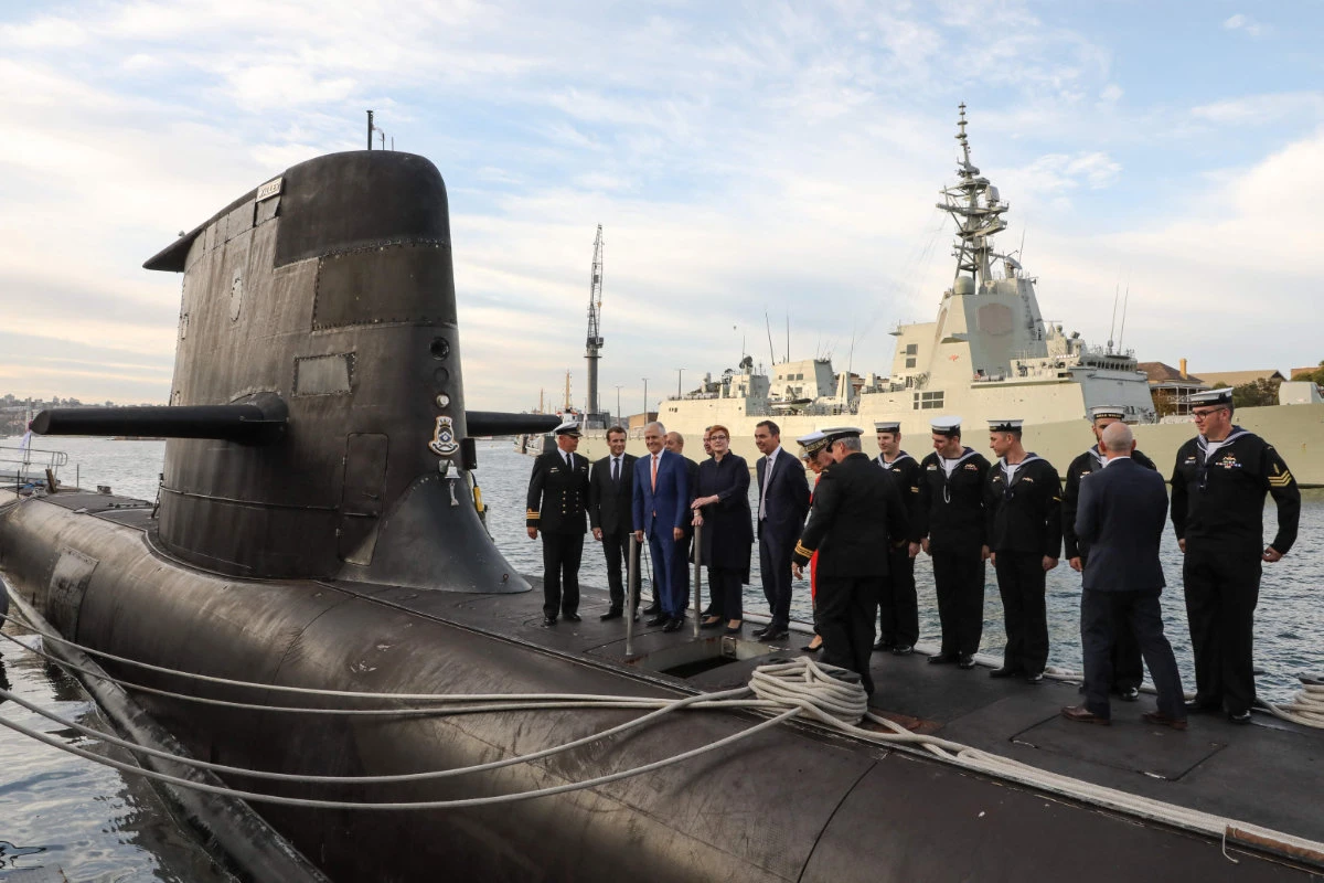 French President Emmanuel Macron (2nd L) and Australian PM Malcolm Turnbull (3rd L) standing on the deck of Australia's submarine HMAS Waller in Sydney in 2016. (AFP)