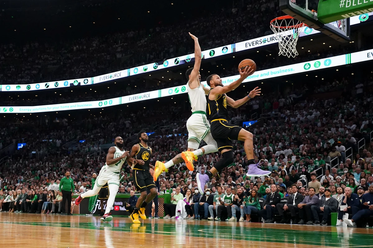 Golden State Warriors guard Stephen Curry drives to the basket against Boston Celtics forward Jayson Tatum during the first quarter of Game 4 in the 2022 NBA Finals at the TD Garden. (USA TODAY Sports)