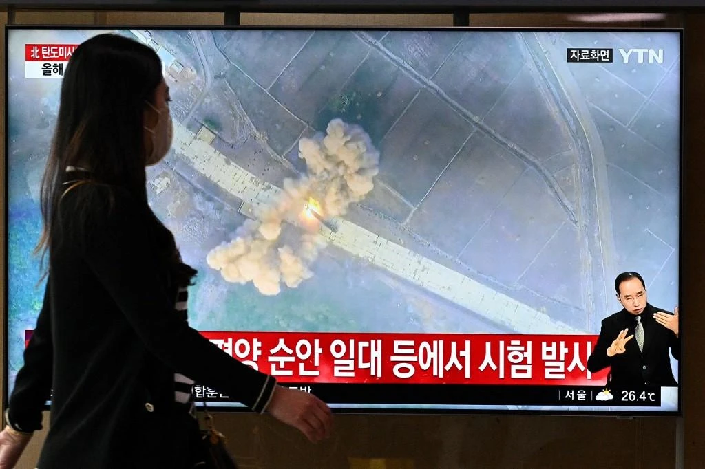 Above, a South Korean broadcaster shows file footage of a North Korean missile test. Pyongyang on June 5, 2022 launched multiple ballistic missiles into waters off its east coast. (AFP)