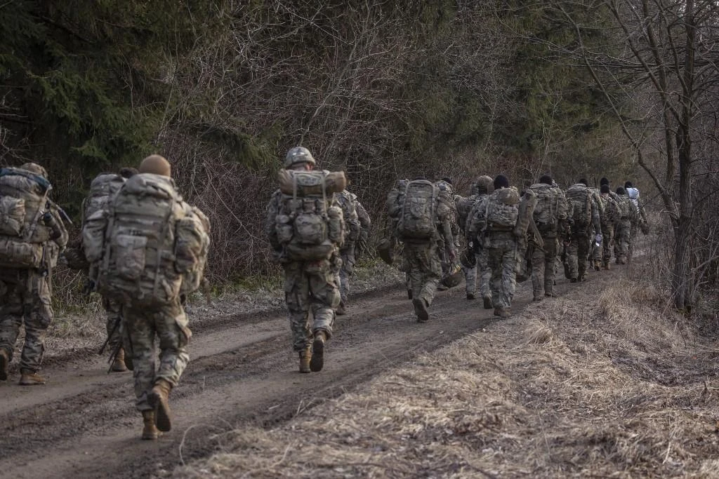 Above, US soldiers near a military camp in Arlamow, southeastern Poland, near the border with Ukraine, on March 3, 2022. (AFP)