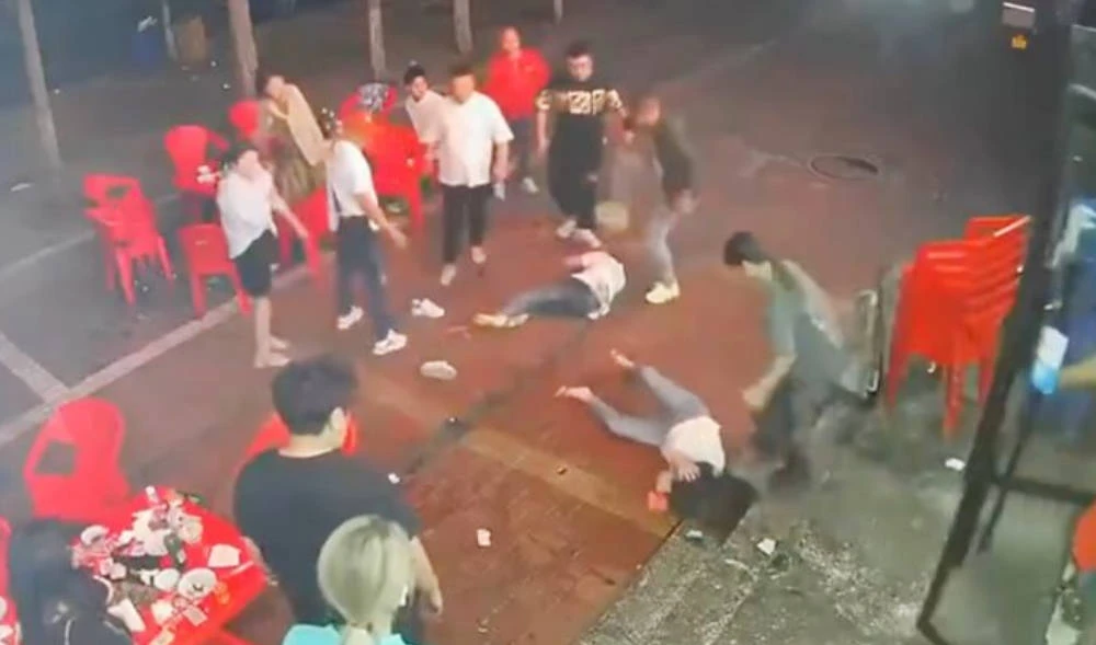 An image grab taken from a video circulated widely on social media shows, women attacked by men in China’s Hebei province. (Twitter @badiucao)