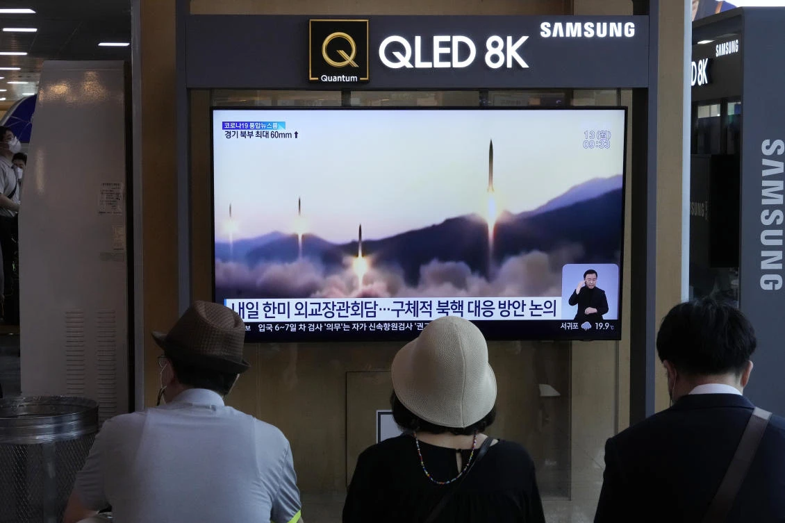 Residents watch a file video of North Korea’s missiles launch during a news program in Seoul on Monday, June 13, 2022. (AP)