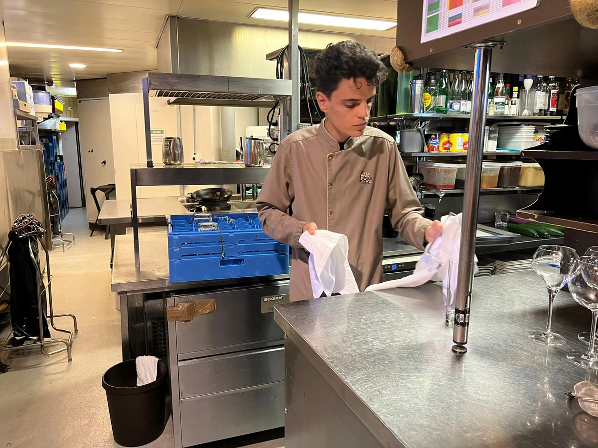 Abdul Rahman Basra, who is from Madinah, works at Lou One, a Chinese restaurant, as part of his training in Switzerland. (Supplied)