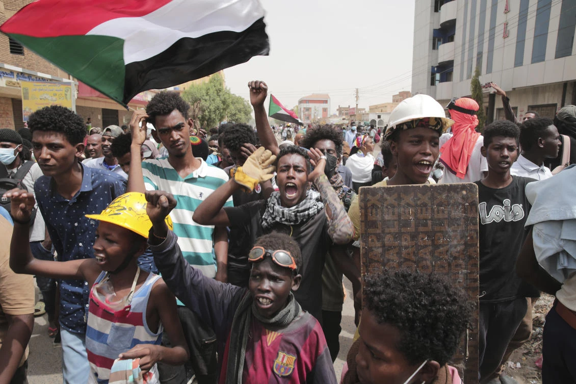 Sudanese demonstrators take to the streets calling for civilian rule and denouncing the military administration, in Khartoum on Thursday. (AP)