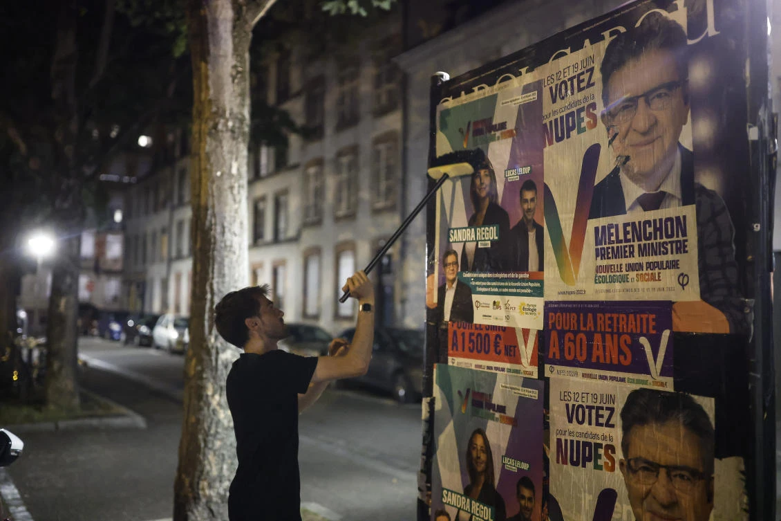 The centrist head of state risks losing his absolute majority in the lower house, owing largely to a strong performance by a newly forged left-wing alliance led by former Socialist Jean-Luc Melenchon. (File/AP)